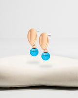 Liliflo_Bijoux interchangeable Swiss made_Boucles d'oreilles Giorgia en couleur acier rosé avec un lien murano aqua
