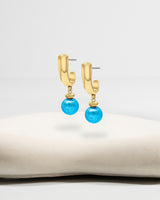 Liliflo_Bijoux interchangeable Swiss made_Boucles d'oreilles Iris en couleur acier doré avec un lien murano aqua
