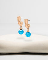 Liliflo_Bijoux interchangeable Swiss made_Boucles d'oreilles Iris en couleur acier rosé avec un lien murano aqua