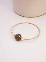 Bracelet en couleur or jaune avec une pierre Bronzite