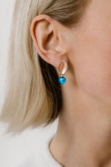 Liliflo_Bijoux interchangeable Swiss made_Boucles d'oreilles Giorgia en couleur acier rosé avec un lien murano aqua