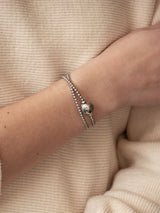 Liliflo, marque de bijoux Suisse : Elément interchangeable_Globe en couleur naturel sur un bracelet tango double