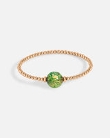 Liliflo_Schmuckbausteine swiss made_Tangoarmband aus Einfache Windung_Farbe rosa mit einem Murano Boreal in der Farbe grün mit Blattgold