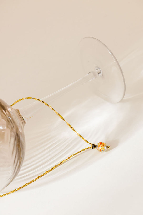 Liliflo_bijoux modulables swiss made_Collier Milonga pour femme_couleur acier doré avec un Murano Confetti avec feuille d’or