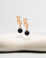 Liliflo_Bijoux interchangeable Swiss made_Boucles d'oreilles Iris en couleur acier rosé avec un lien pierre semi-précieuse onyx